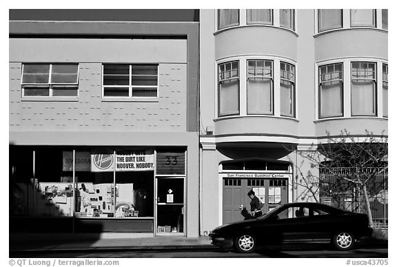 Street with brighly painted buildings, Mission District. San Francisco, California, USA (black and white)