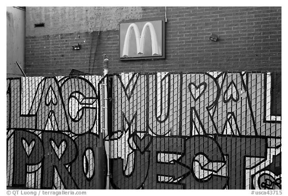 Hand-drawn letters and commercial logo, Mission District. San Francisco, California, USA (black and white)