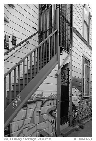 Mural at the bottom of house facade, Mission District. San Francisco, California, USA (black and white)