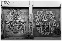 Two painted garage doors, Mission District. San Francisco, California, USA (black and white)
