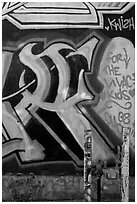 Posts and painted wall detail, Mission District. San Francisco, California, USA (black and white)