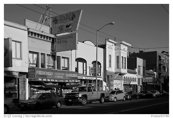 Shops, Mission Street, late afternoon, Mission District. San Francisco, California, USA (black and white)