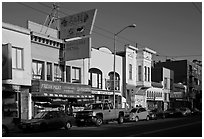 Shops, Mission Street, late afternoon, Mission District. San Francisco, California, USA (black and white)