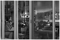 Cafe seen through windows, Mission District. San Francisco, California, USA (black and white)