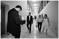 Soon to be maried couple and witness in City Hall corridor. San Francisco, California, USA (black and white)