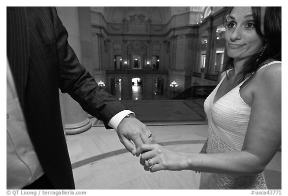 Newly wed bride looks over rings, City Hall. San Francisco, California, USA (black and white)