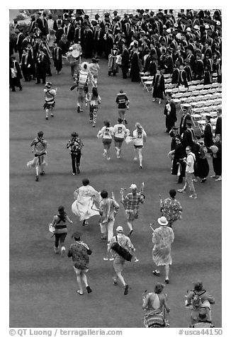 Band members run at the end of commencement ceremony. Stanford University, California, USA (black and white)