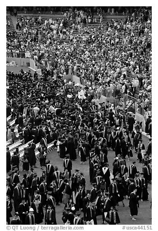 Graduates gather in front of family and friends after commencement. Stanford University, California, USA