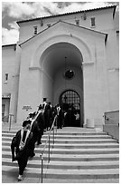 Graduating students in academic robes walk into Memorial auditorium. Stanford University, California, USA (black and white)