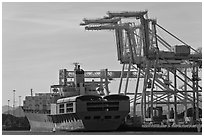 Cranes and cargo ship, Oakland port. Oakland, California, USA ( black and white)