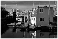 Houseboat and Oakland skyline. Oakland, California, USA (black and white)