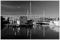 Alameda Houseboats and Oakland skyline. Oakland, California, USA ( black and white)