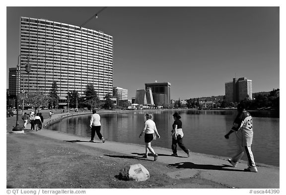 People strolling around 3.5 mile path around Lake Merritt. Oakland, California, USA