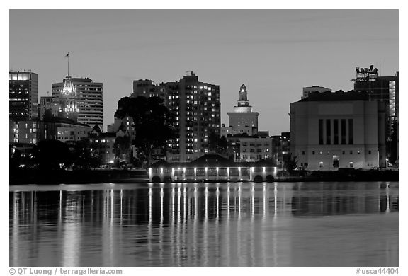 Downtown skyline accross Lake Merritt at dusk. Oakland, California, USA (black and white)