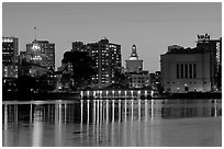 Downtown skyline accross Lake Merritt at dusk. Oakland, California, USA (black and white)