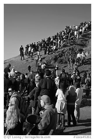 Spectators on bluff during mavericks contest. Half Moon Bay, California, USA