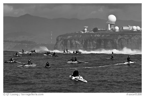Flottila of personal watercraft near Mavericks break in front of  Pillar Point air force station. Half Moon Bay, California, USA (black and white)