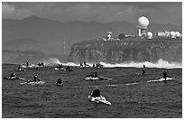 Flottila of personal watercraft near Mavericks break in front of  Pillar Point air force station. Half Moon Bay, California, USA ( black and white)