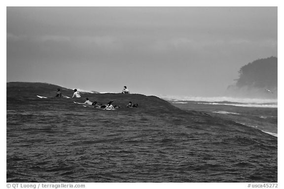 Surfers waiting for wave at Mavericks. Half Moon Bay, California, USA (black and white)