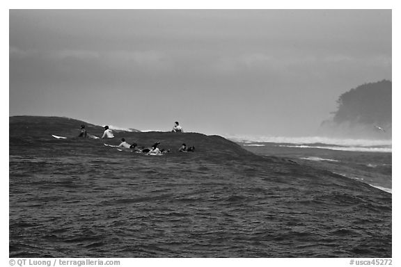 Surfers waiting for wave at Mavericks. Half Moon Bay, California, USA