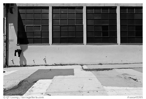 Industrial building and painted sidewalk. Berkeley, California, USA (black and white)