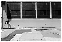 Industrial building and painted sidewalk. Berkeley, California, USA (black and white)