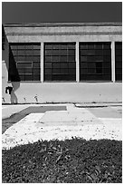 Sidewalk and industrial building facade. Berkeley, California, USA ( black and white)