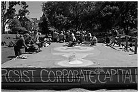 People gathered behind podium, Peoples Park. Berkeley, California, USA ( black and white)