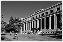 Students biking in front of Life Sciences building. Berkeley, California, USA (black and white)