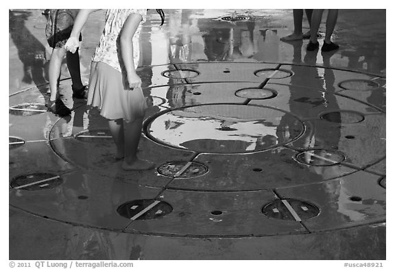 Reflections of children playing in fountain, Gilroy Gardens. California, USA