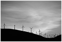 Wind farm silhouetted on hill, Altamont. California, USA (black and white)