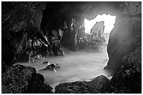 Looking through Pfeiffer Beach arch. Big Sur, California, USA (black and white)