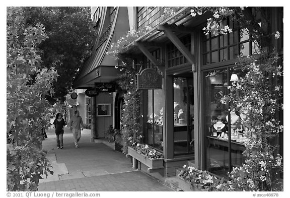 Sidewalk and stores on Ocean Avenue. Carmel-by-the-Sea, California, USA (black and white)