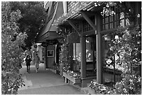 Sidewalk and stores on Ocean Avenue. Carmel-by-the-Sea, California, USA (black and white)