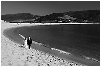 Groom and bride, Carmel River Beach. Carmel-by-the-Sea, California, USA (black and white)