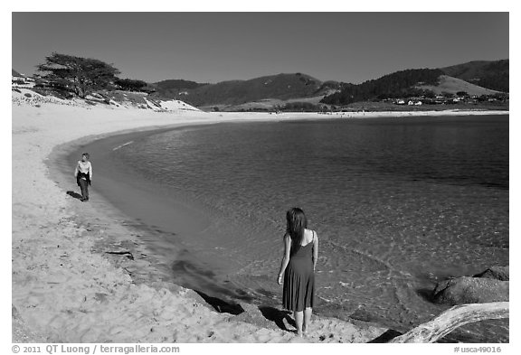 Women stroll on Carmel River Beach. Carmel-by-the-Sea, California, USA (black and white)