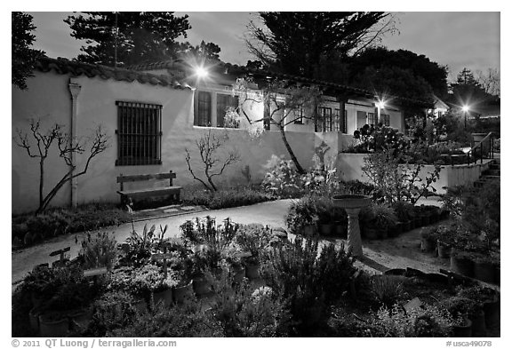 Garden and historic adobe house at night. Monterey, California, USA