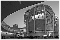 Crowd gathered around rotunda at dusk, San Jose City Hall. San Jose, California, USA ( black and white)