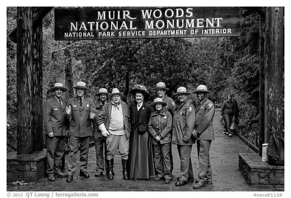 Rangers posing with Theodore Roosevelt under entrance gate. Muir Woods National Monument, California, USA (black and white)