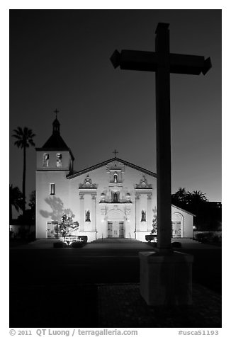 Cross and Santa Clara Mission at dusk. Santa Clara,  California, USA (black and white)