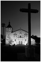 Cross and Santa Clara Mission at dusk. Santa Clara,  California, USA (black and white)