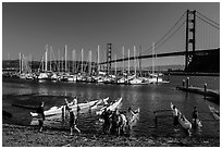 Horseshoe Bay, canoes, yachts and Golden Gate Bridge. California, USA (black and white)