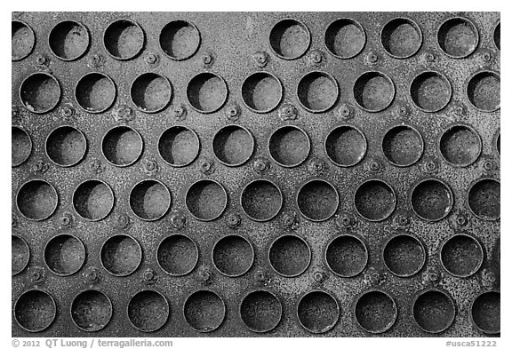 Grid of holes in metal, Shipyard No 3, Rosie the Riveter Front National Historical Park. Richmond, California, USA (black and white)