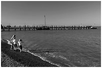 Girls on China Camp Beach near pier, China Camp State Park. San Pablo Bay, California, USA (black and white)