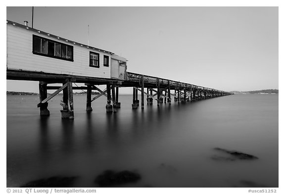 Long pier at sunset, San Pablo Bay. San Pablo Bay, California, USA (black and white)