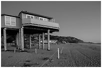 Beach house with high stilts, Stinson Beach. California, USA (black and white)
