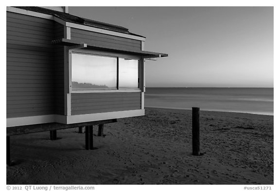 Modern beach house with large window reflecting sunset, Stinson Beach. California, USA (black and white)