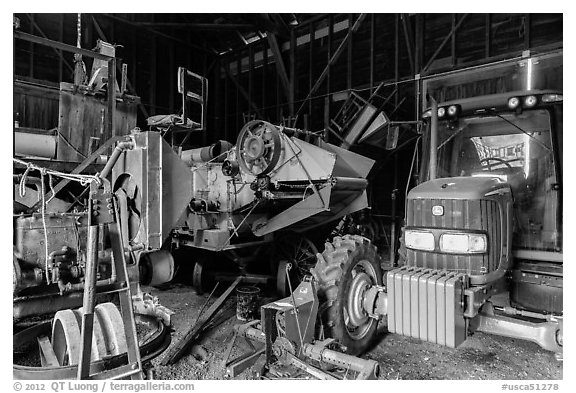 Barn full of agricultural machinery, Ardenwood farm, Fremont. California, USA (black and white)