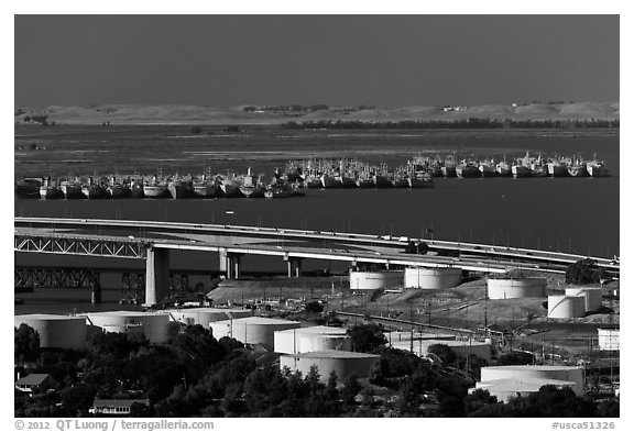 Oil tanks, Carquinez Strait, and mothball fleet. Martinez, California, USA (black and white)