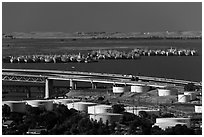 Oil tanks, Carquinez Strait, and mothball fleet. Martinez, California, USA (black and white)